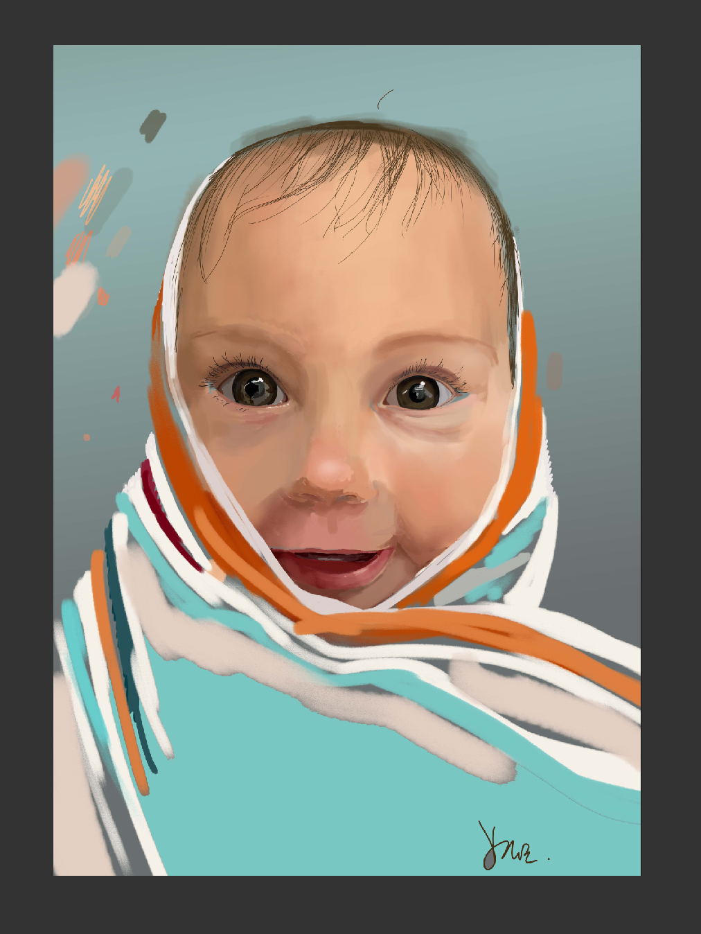 Portrait of a baby wrapped in a colourful blanket